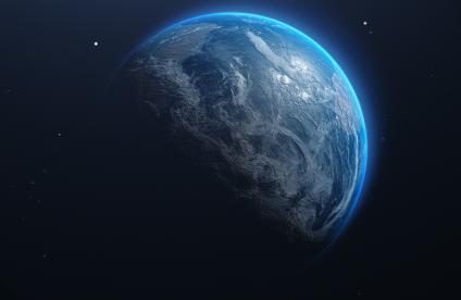 Photo de la planète Terre vue de l'espace, entourée d'un halo bleuté