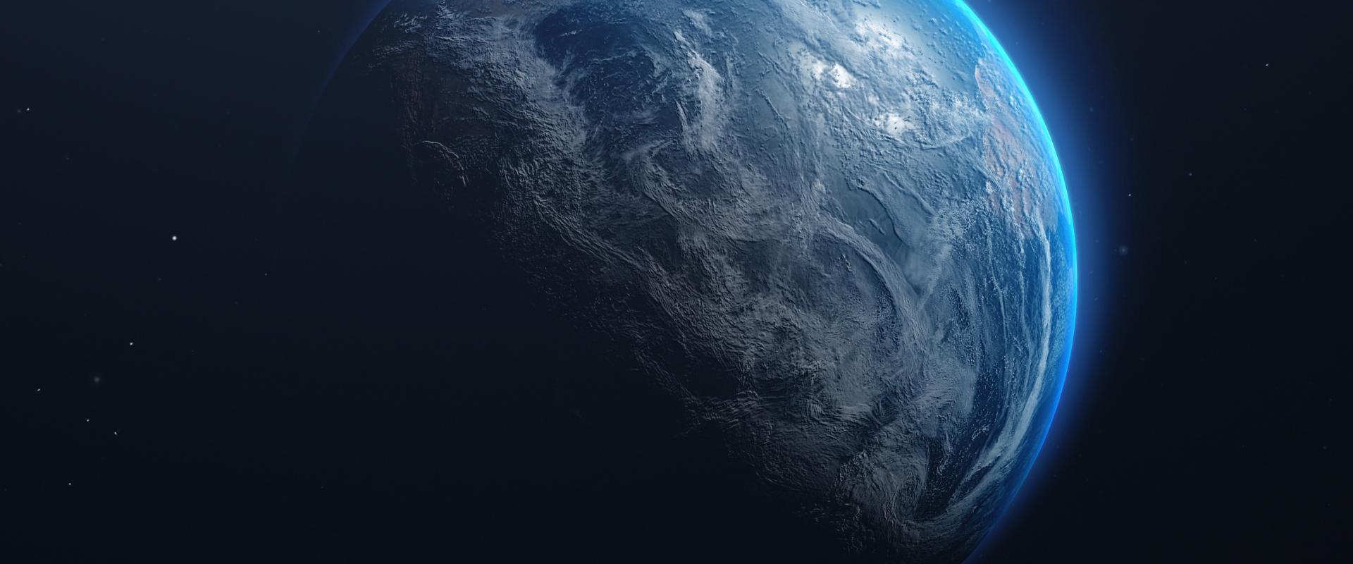 Photo de la planète Terre vue de l'espace, entourée d'un halo bleuté